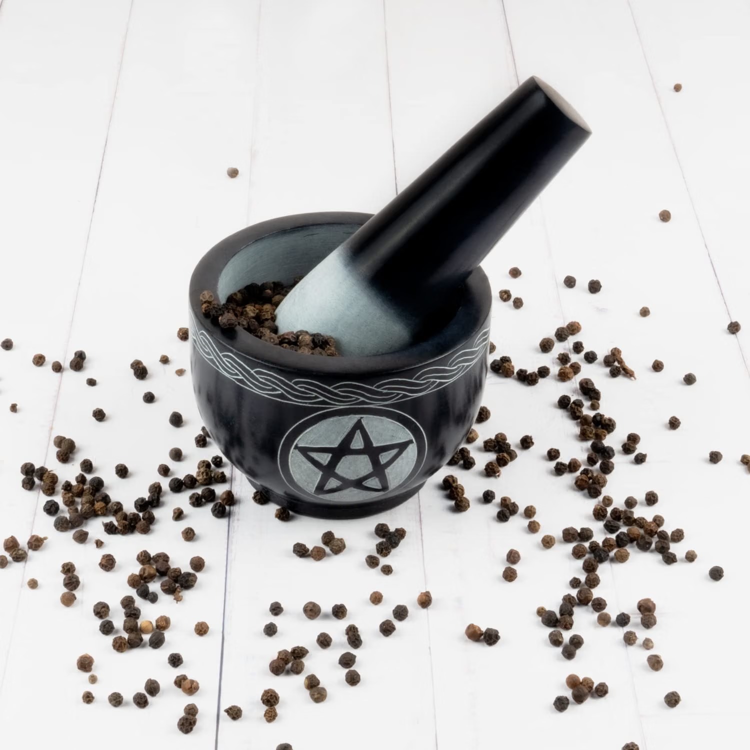 Kaizen Casa black soapstone mortar and pestle engraved with a pentagram and Celtic knotwork border