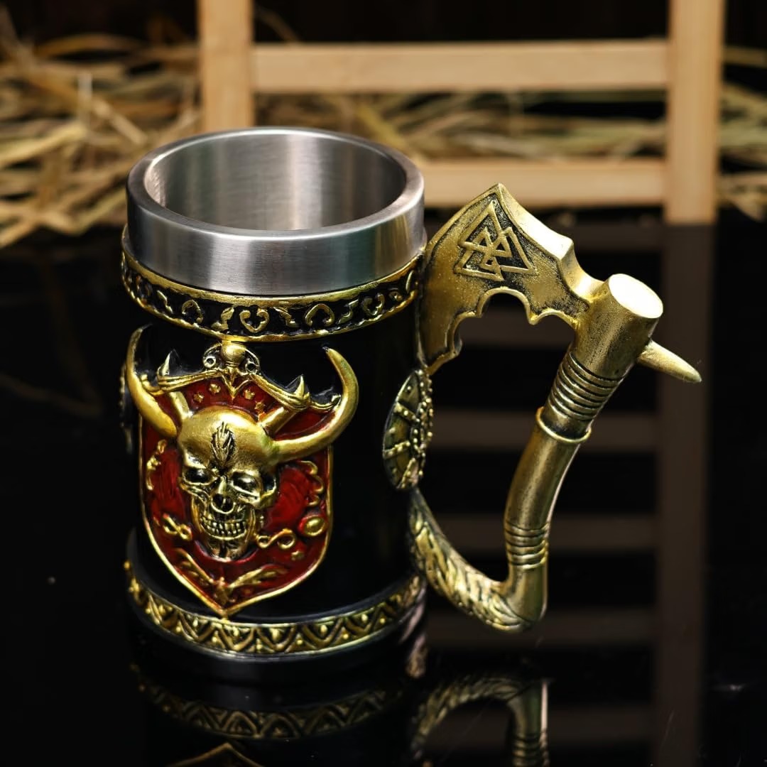 Bronze-finished tankard with a horned skull shield emblem and a battle-axe-shaped handle bearing a Valknut symbol