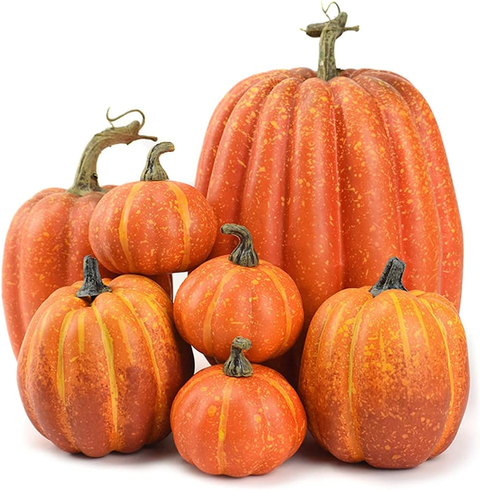 Seven artificial foam pumpkins in mixed sizes and shapes