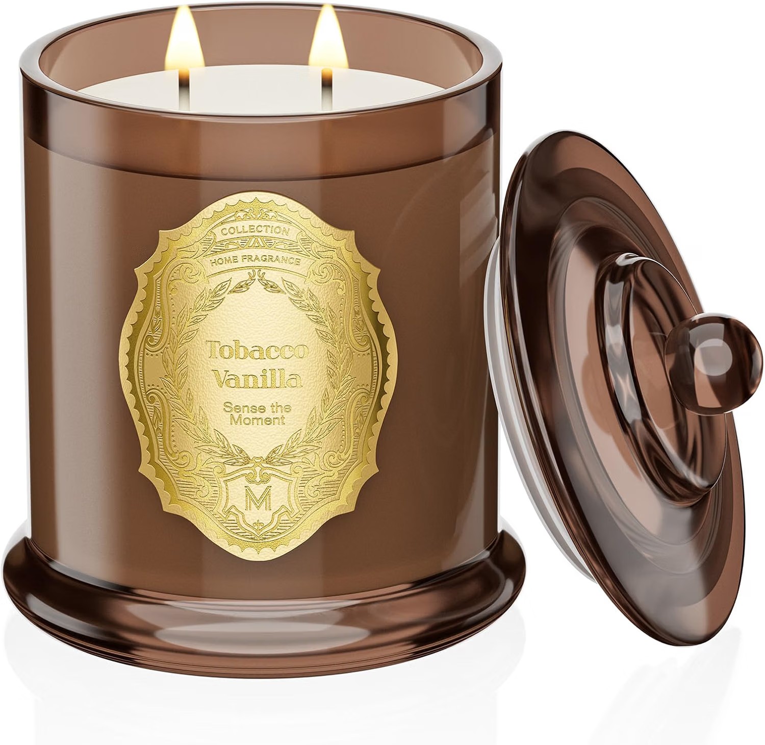Tobacco Vanilla two-wick candle in a smoked brown glass jar with a gold crest label and matching lid