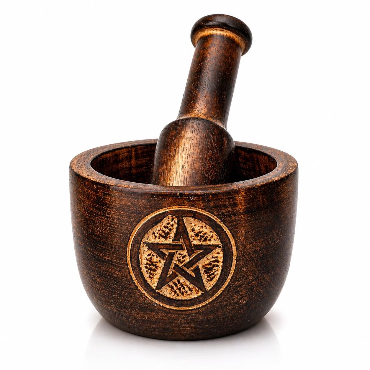 Carved wooden mortar and pestle with a bronzed antique finish and a gold-tone pentagram medallion