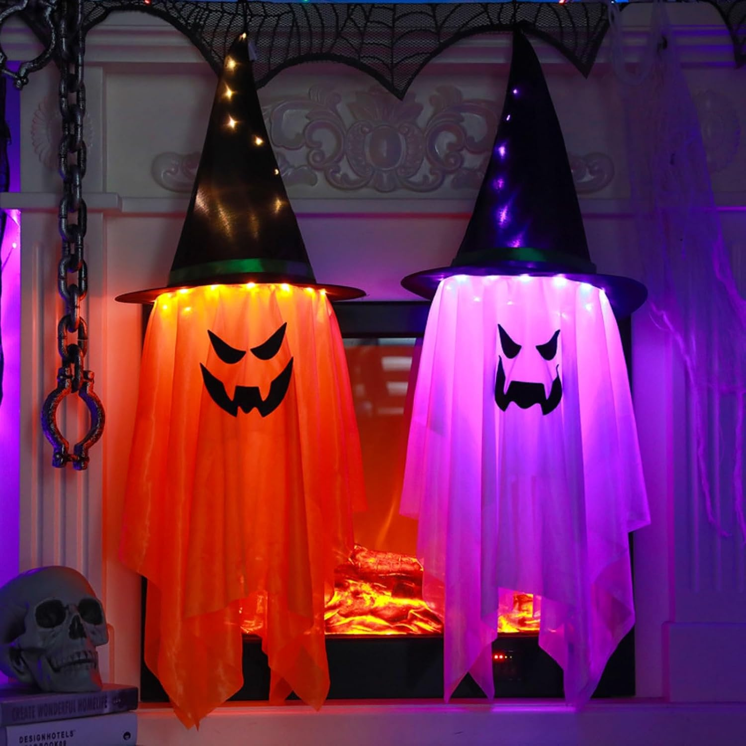 Two large light-up hanging ghost decorations with witch hat and pumpkin accents