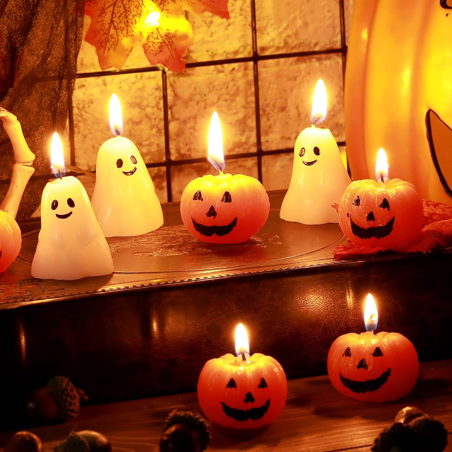 Twelve pumpkin and ghost shaped scented tealight candles