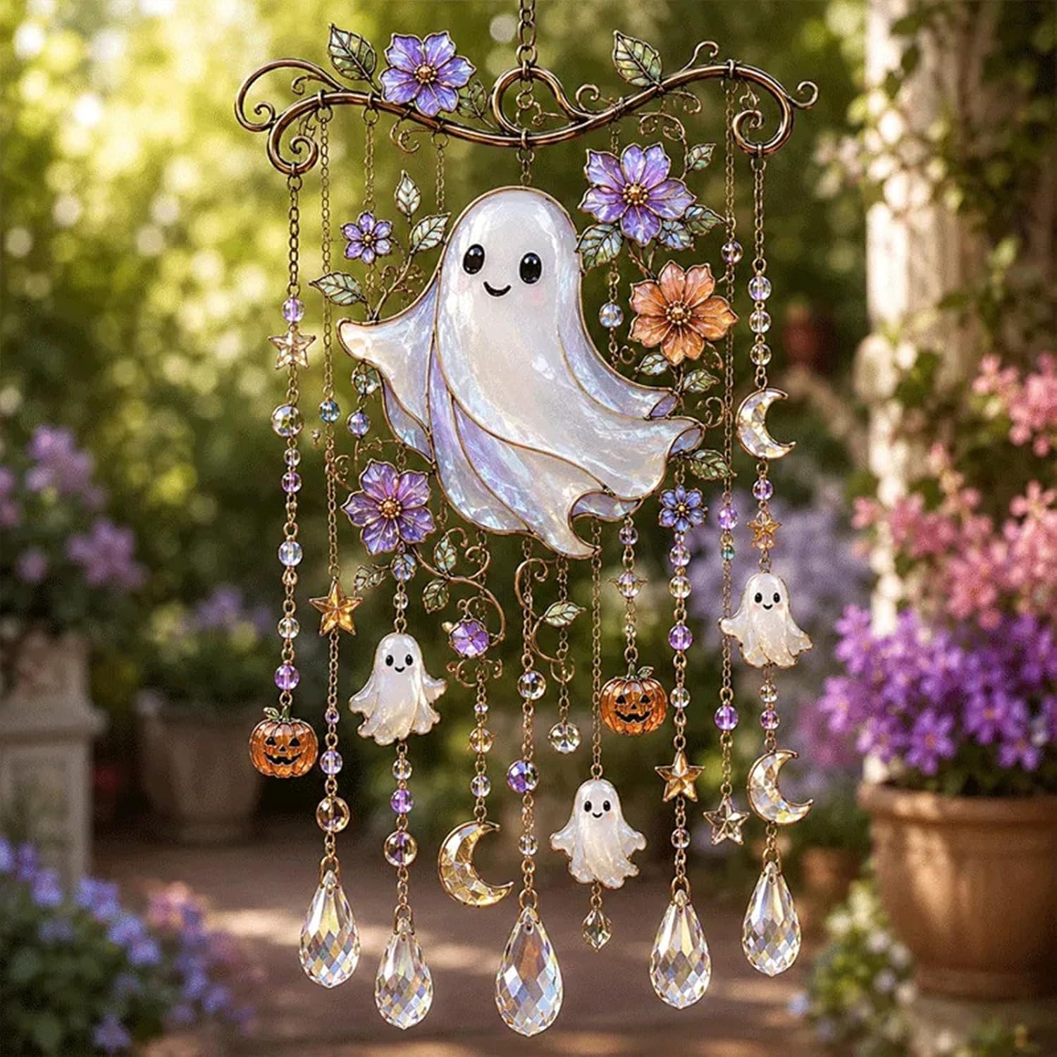 Halloween crystal wind chime with a stained-glass style ghost, flowers, and hanging ghost, pumpkin, moon and star charms with faceted crystal drops