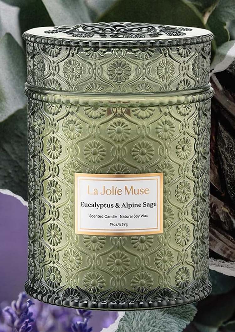 La Jolie Muse Eucalyptus & Alpine Sage scented candle in an embossed sage-green glass jar with a matching lid