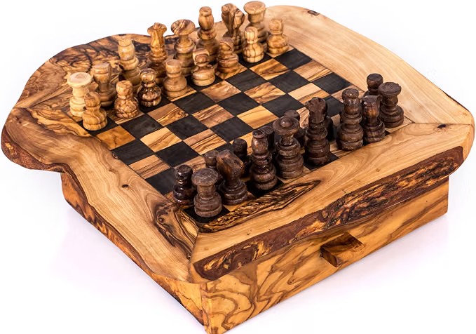 Rustic olive wood chess set with a live-edge board, hidden storage drawer, and finely carved light and dark wooden pieces