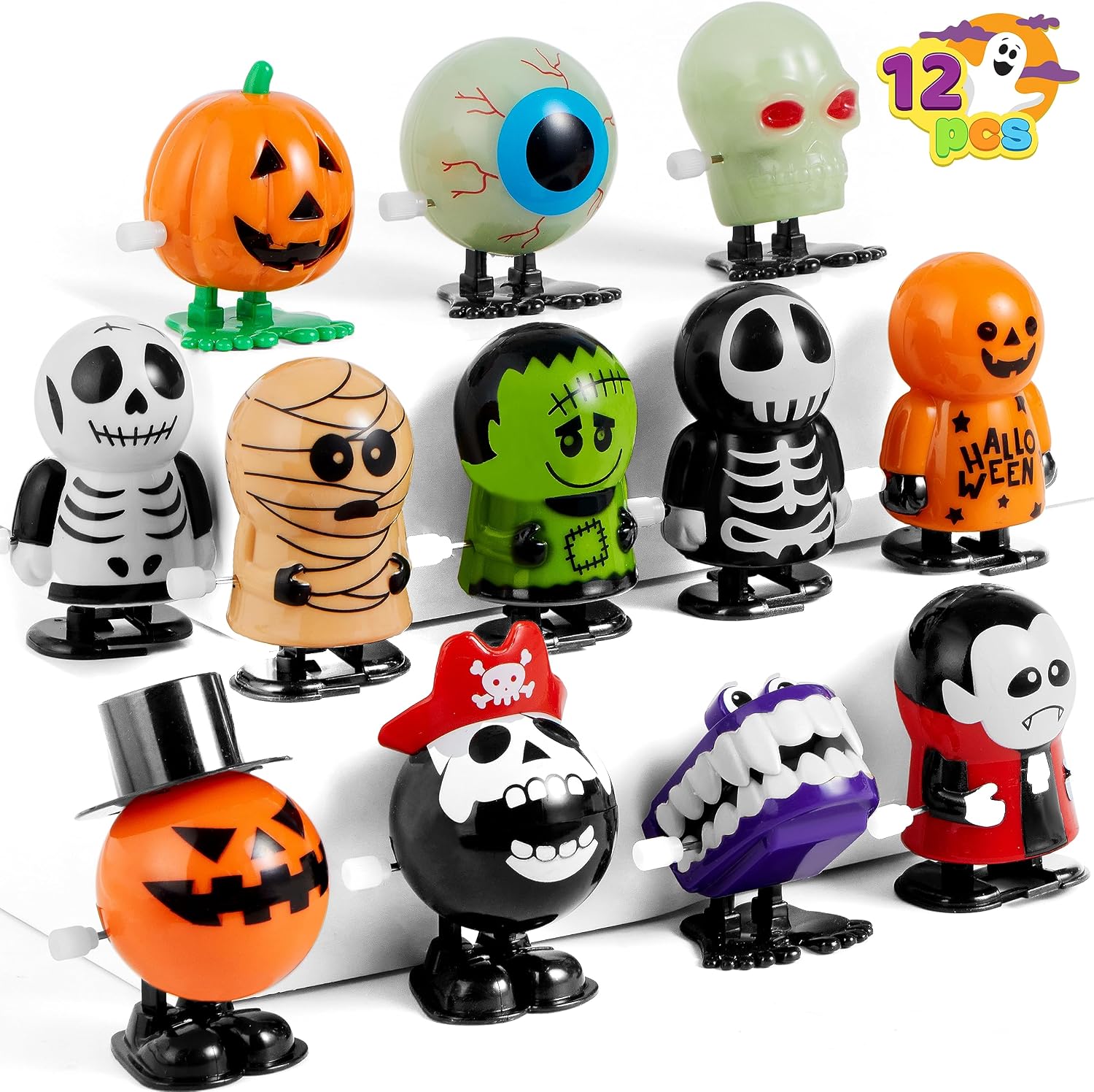 Set of 12 wind-up walking Halloween toys including a pumpkin, eyeball, skull, mummy, Frankenstein's monster, skeletons, a pirate skull, a vampire and a monster with big teeth