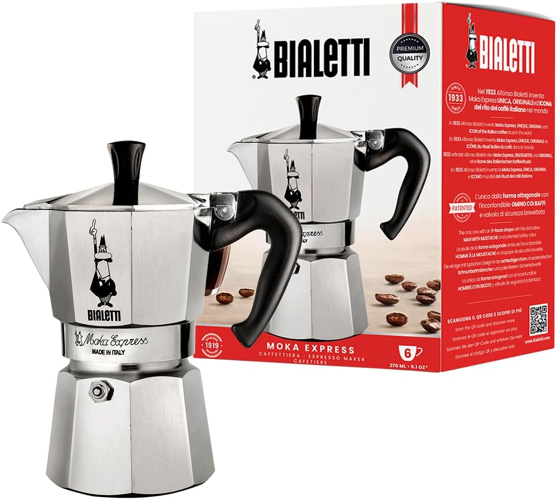 Classic aluminium Bialetti Moka Express stovetop coffee maker beside its red box
