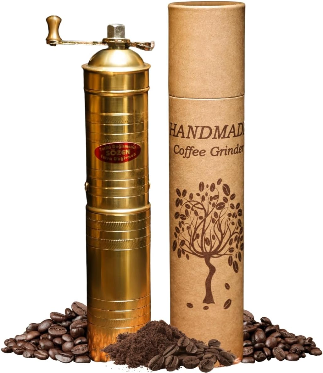 Tall handmade brass Turkish coffee grinder with a folding crank handle, beside its gift tube