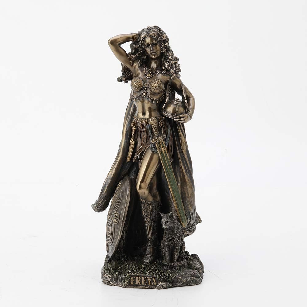 Antique bronze-finish figurine of the Norse goddess Freya with flowing hair, a shield at her side and a cat at her feet, on a base marked Freya