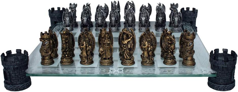 Nemesis Now Kingdom of the Dragon chess set, bronze and silver resin pieces of dragons, wizards and warriors on a frosted glass board with Celtic knotwork, raised on four castle-turret feet