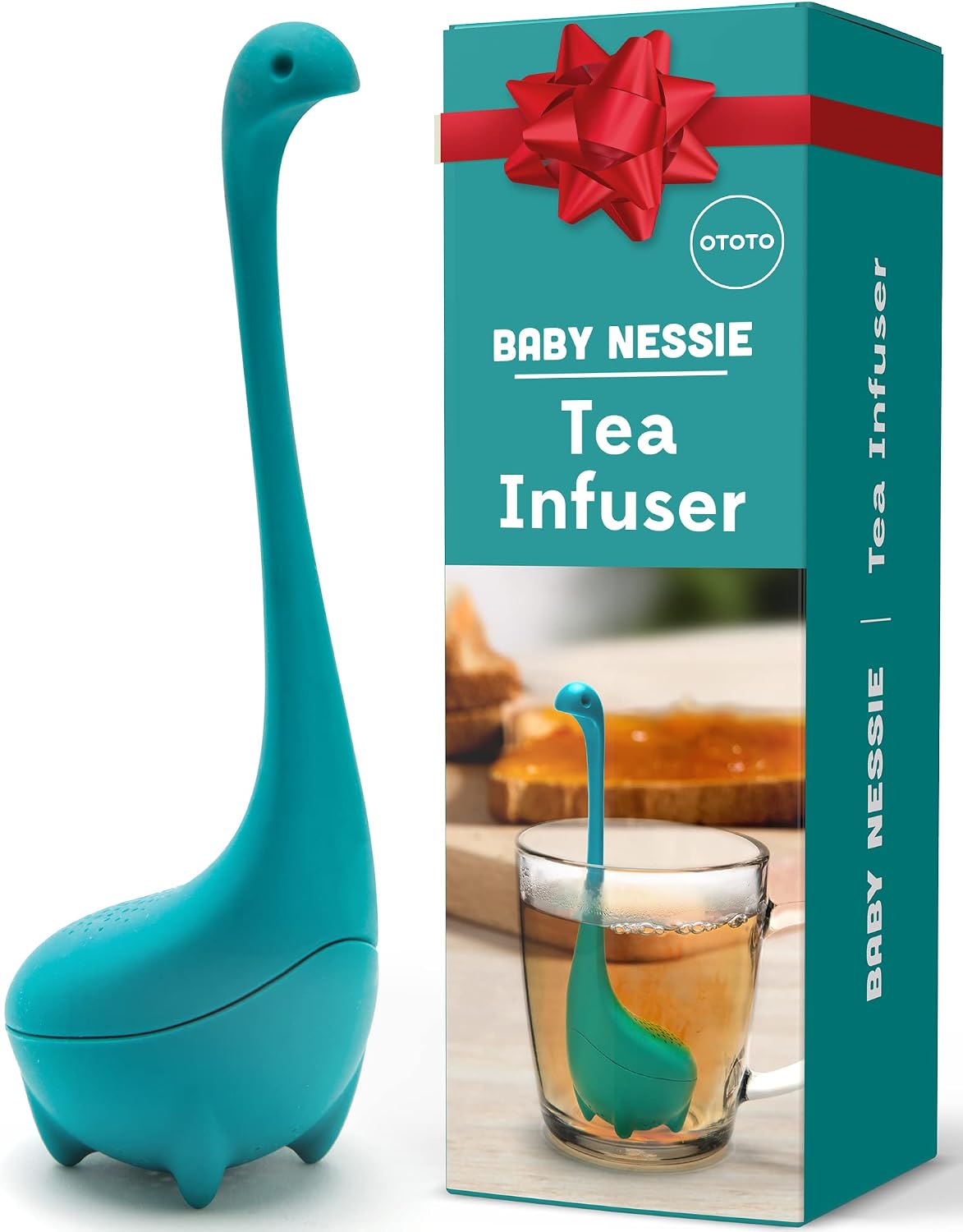 Turquoise silicone tea infuser shaped like a long-necked Loch Ness monster, beside its gift box