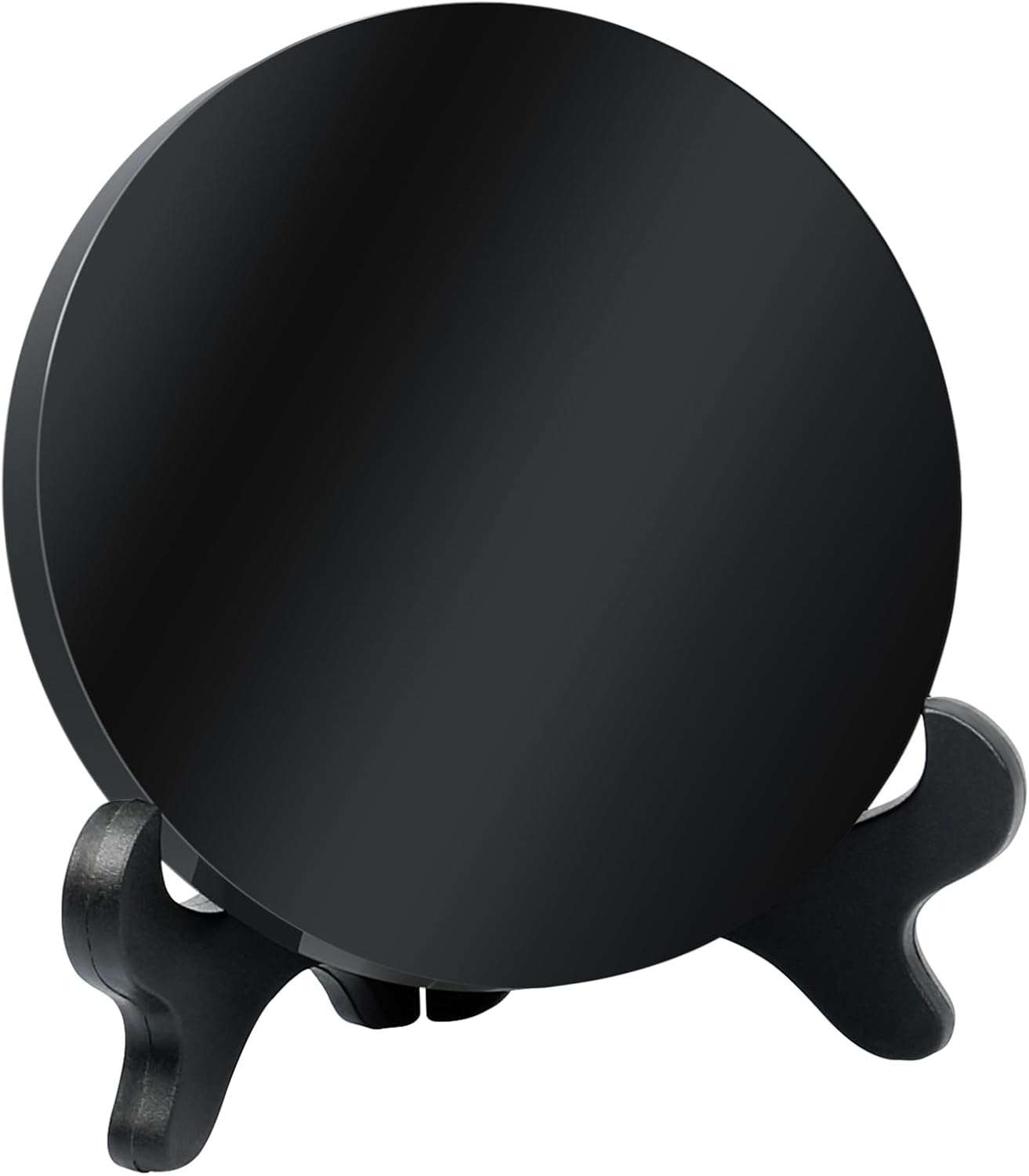 Round polished black obsidian scrying mirror propped on a black display stand