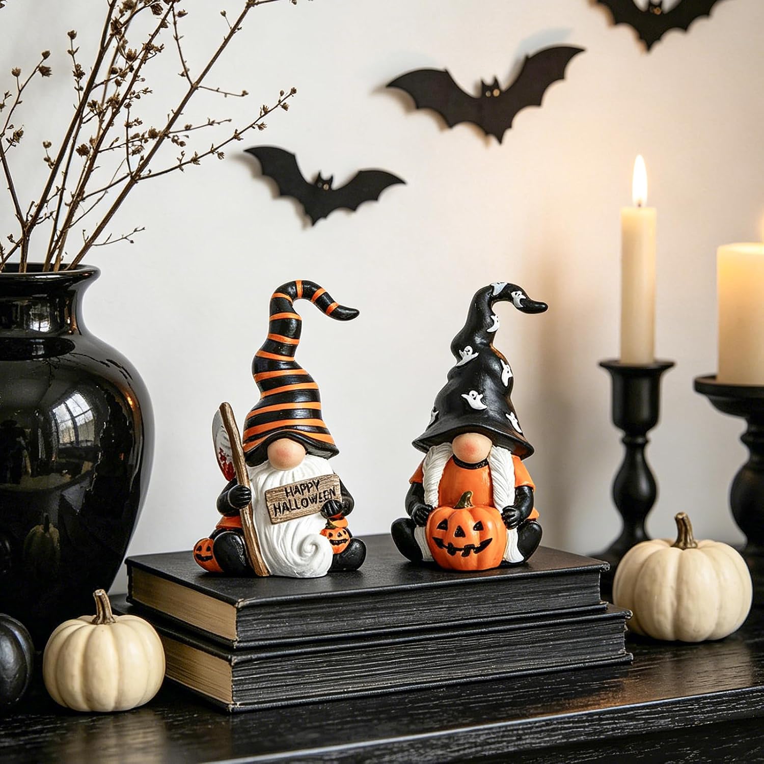 Orange and black resin Halloween gnomes, one holding a Happy Halloween sign, one holding a pumpkin