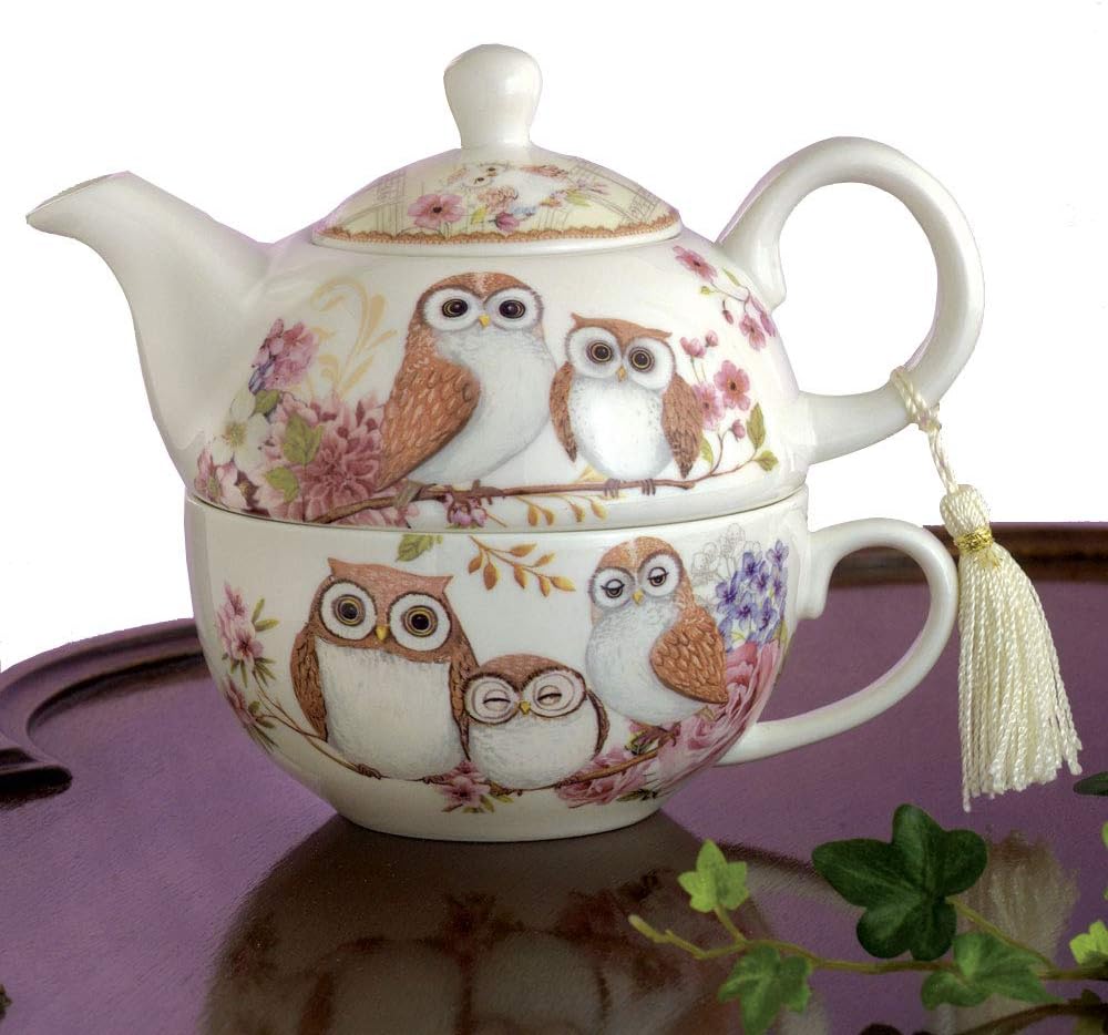 Porcelain tea-for-one set, a small teapot stacked on a matching cup, both painted with families of owls among pink blossom, with a tassel on the handle