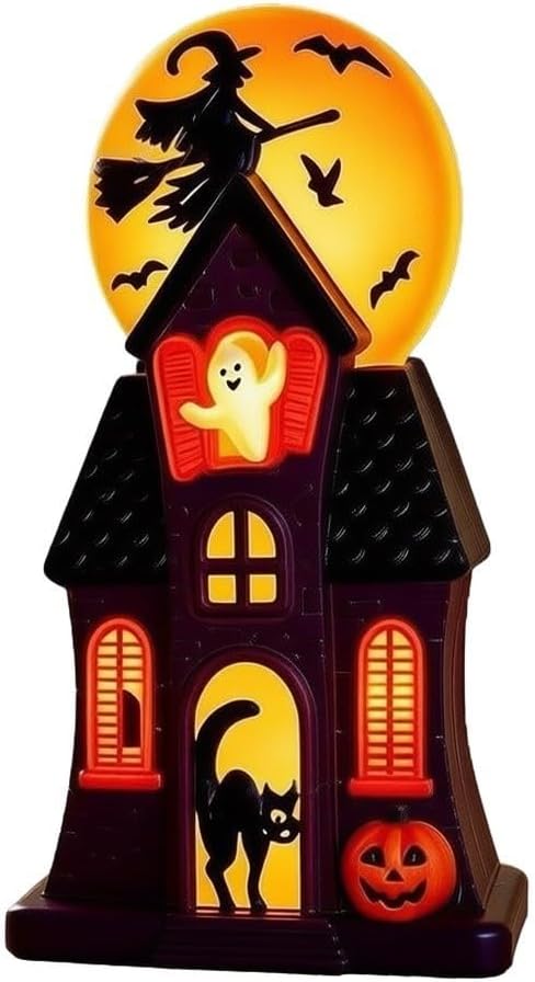 Light-up haunted house ornament in purple and black with glowing orange windows, a ghost waving from the top window, a black cat in the doorway and a jack-o'-lantern, against a big glowing moon with a witch on a broomstick and bats