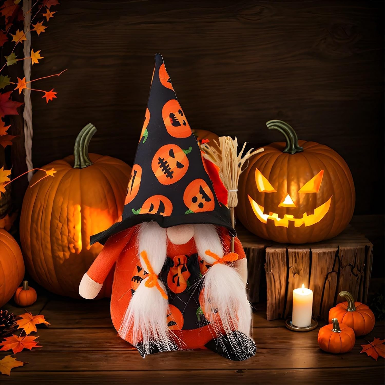 Candy-corn striped gnome under a tall witch hat printed with jack-o'-lanterns