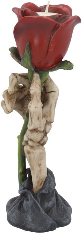 Resin tealight holder of a skeletal hand rising from a rock and holding a red rose, with a tealight set inside the bloom
