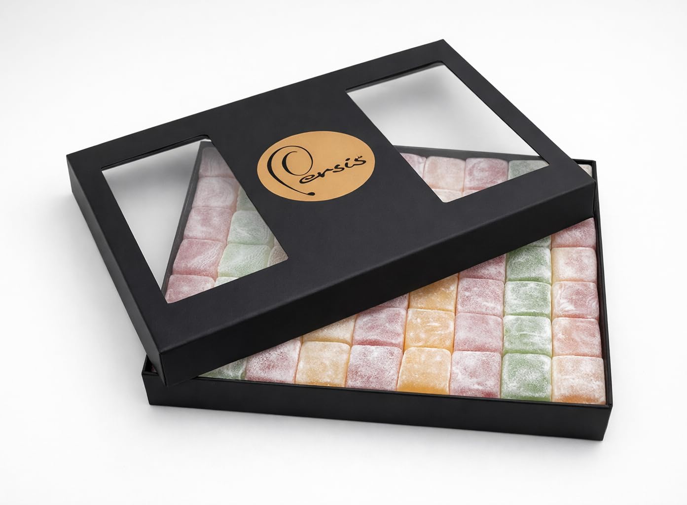 Black window gift box packed with rows of pastel Turkish delight cubes
