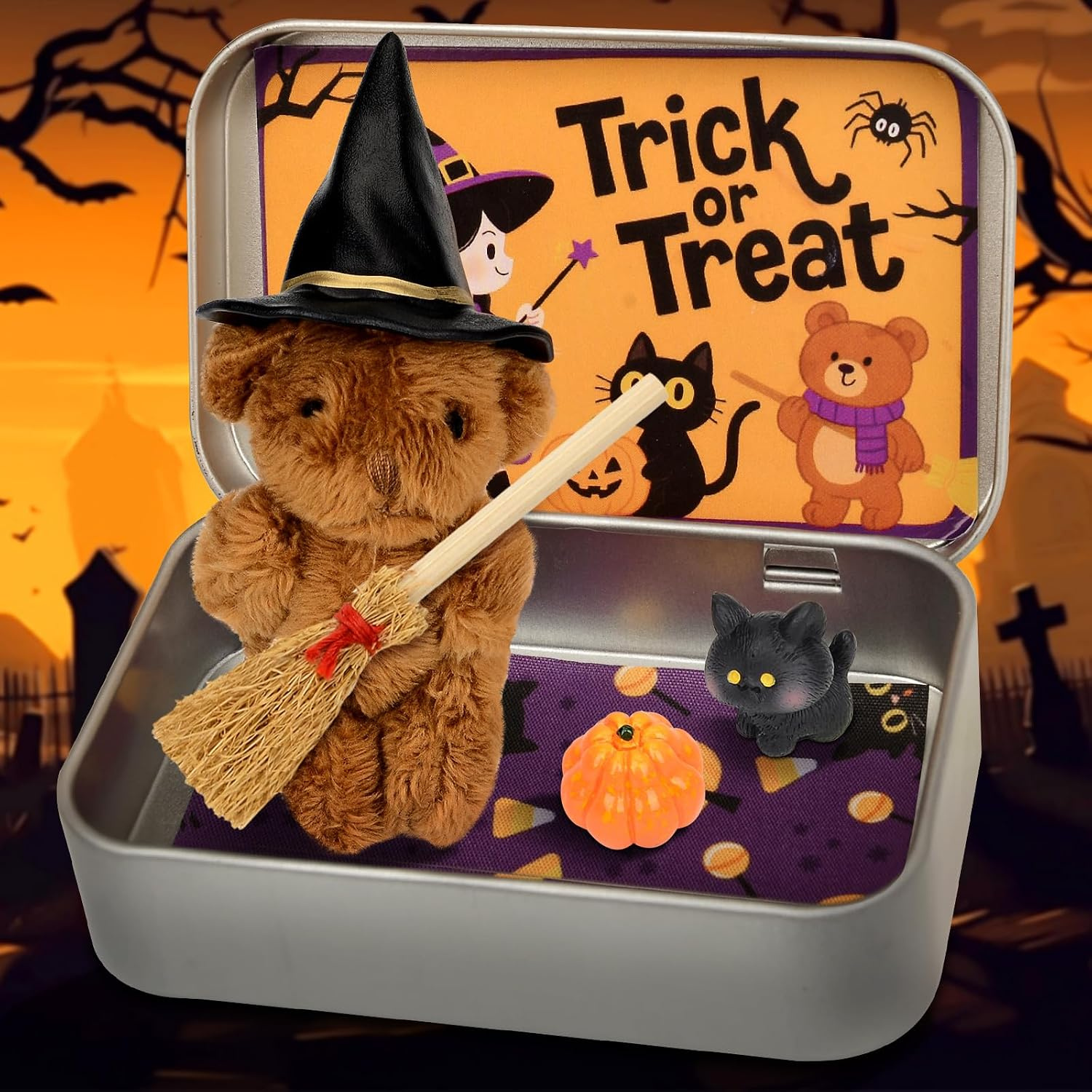 Small handmade teddy bear dressed as a witch inside a Trick or Treat tin box