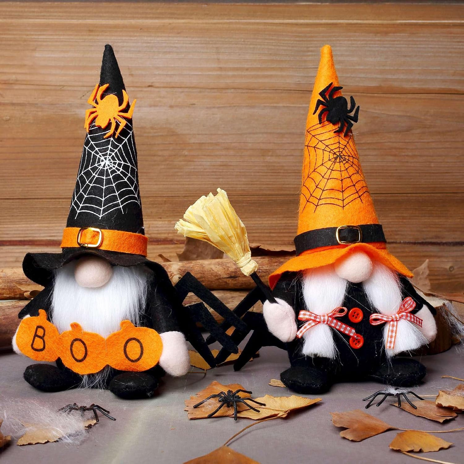 Plush witch and wizard gnome pair with spiderweb cloak, Boo sign, and pumpkin-pattern hat